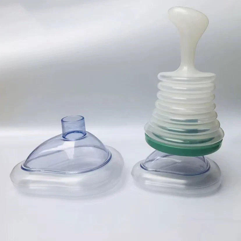 Airway Clearing Device with Manual Suction and Universal Mask Fit