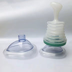Airway Clearing Device with Manual Suction and Universal Mask Fit