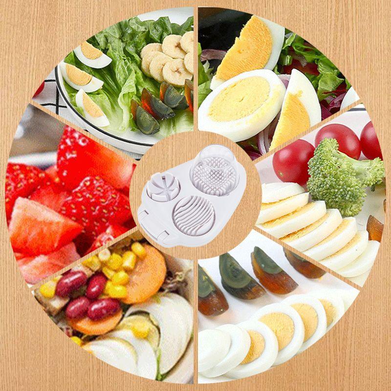Multi-blade egg slicer tool with various sliced eggs, fruits, and vegetables on wood background